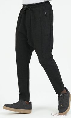 QL Relaxed Trousers City in Black Description: QL Relaxed Trousers City are meant for comfort and style. Another sporty classic outfit that is movable and breathable. Designed with an elastic waistband with an adjustable drawstring for a custom fit and zipped side pockets. These trousers are structured and unfussy, perfect for any casual day with a sporty and active vibe. Modern Islamic clothing for men Very high-quality fabric from top brands Elastic waist with drawstring closure With two side Casual Fitted Black Joggers, Casual Black Fitted Joggers, Casual Straight Leg Joggers For Workwear, Casual Black Stretch Sweatpants, Black Stretch Casual Joggers, Fitted Black Casual Sweatpants, Black Stretch Straight Leg Sweatpants, Black Business Casual Bottoms With Pockets, Business Casual Black Bottoms With Pockets