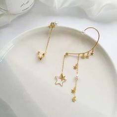 Dainty handmade no piercing mismatched ear wrap, ear cuff, ear climber, ear crawler. Sold as 1 pair. One side is dangling starry and pearl ear wrap, the other side is cz star cluster ear cuff. No ear hole necessary, easy to adjust and pair at your personal fit preference, super convenient. Gold plated sterling silver, sparkly dainty delicate earrings. Perfect as everyday jewelry, also looks gorgeous as party/bridal bridesmaid/wedding accessories! ♥ All of our jewelry are carefully handmade with Star Shaped Ear Climbers As Gift, Star-shaped Ear Climbers For Pierced Ears, Star-shaped Ear Climbers As Gift, Star-shaped Ear Climbers For Gift, Minimalist Ear Cuff, Ear Crawler, Tassel Earing, Ear Crawlers, Conch Earring