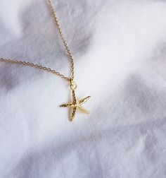 Necklace with a small starfish made of high-quality 925 sterling silver with 14 carat multiple gold plating. The piece of jewelry is covered with 2 layers of gold - a base layer and a top layer, which increases the durability of the coating. The chain is available in three lengths and comes with an extension of approx. 5 cm. The pendant has a size of 20 mm. 🤍 Nickel free 🤍 Rustproof 🤍 Hypoallergenic 🤍 no discoloration This necklace is also available in silver! https://www.etsy.com/de/listing Elegant Starfish Charm Jewelry As Gift, Elegant Starfish Charm Jewelry For Gifts, Elegant Starfish Charm Jewelry Gift, Dainty Starfish Charm Jewelry For Gift, Minimalist Starfish Jewelry Gift, Gold Jewelry With Starfish Charm As A Gift, Dainty Starfish Charm Jewelry Gift, Minimalist Gold Jewelry With Starfish Charm, 14k Gold Filled Necklaces With Star Charm For Gifts