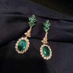 Expertly crafted with green cubic zirconia stones, these earrings add a pop of color to any outfit. The broken design adds a unique touch, making them a conversation starter. - Color: Green- Style: Earrings- Closure Type: Stud- Stone Type: Zircon- Gender: Women Green Diamond Earrings For Formal Occasions, Green Diamond Drop Earrings, Fine Jewelry Green Drop Earrings, Green Cubic Zirconia Diamond Drop Earrings, Green Cubic Zirconia Crystal Earrings For Party, Green Fine Jewelry Drop Earrings, Green Cubic Zirconia Party Earrings, Green Diamond Earrings For Parties, Green Cubic Zirconia Drop Earrings