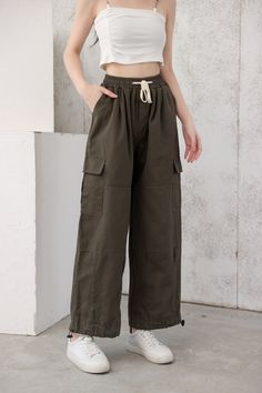 These wide-leg cargo pants are just what you need to get through the day. These baggy pants are perfect for running errands, heading to class, or relaxing at home. Made from a lightweight material, these pants will be your new go-to. Add a pop of color with a shirt or button-down top and pair it with your favorite sneakers.
Gender: WomenMaterial: PolyesterClothing Length: Full LengthClosure Type: Elastic Waist Summer Wide Leg Cargo Pants For Outdoor Activities, Summer Wide Leg Pants For Outdoor Activities, Green Wide Leg Cargo Pants Relaxed Fit, Relaxed Fit Green Wide Leg Pants With Cargo Pockets, Wide Leg Cotton Cargo Jeans For Outdoor Activities, Utility Wide Leg Cargo Style Sweatpants, Utility Wide Leg Cargo Sweatpants, Relaxed Fit Cargo Jeans For Spring Outdoor, Utility Cargo Style Wide Leg Sweatpants