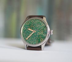 Custom  made watch, Swiss made movement  ETA 6498, custom mechanical wind up watch, Green enameled dial  - movement:mechanical, incabloc 17jewels, manual winding Case material: 316L stainless steel Case size: 44 mm Lug to lug: 52mm Glass : mineral Thickness:12mm Band Width: 22mm See more of our watches: https://www.etsy.com/shop/RetroWatchMZLtd Watch Green, We Watch, Wristwatch Men, Wrist Watches, Swiss Made, Cool Watches, Quartz Watch, Stainless Steel Case, Bulgaria