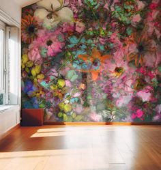 the wall is covered with colorful flowers and plants