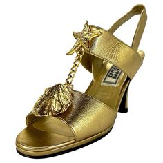 Check out this item from 1stdibs! S/S 1992 Gianni Versace Gold Mare Heel Heels Size 36: https://www.1stdibs.com/id-v_15863302 Gold Sandals With Sculpted High Heel, Gold High Heel Sandals With Sculpted Heel, Luxury Gold Sandals For Summer, Designer Gold Open Toe Sandals, Gold Sandals With Sculpted Heel For Gala, Gold Pointed Toe Sandals For Gala, Luxury Gold Open Heel Sandals, Luxury Gold Sandals With Round Toe, Luxury Gold Pointed Toe Sandals