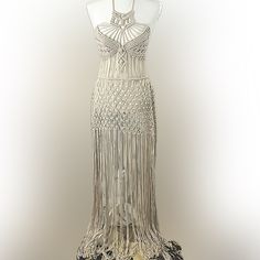 a mannequin wearing a dress with fringes on it