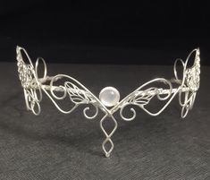 This is a butterfly bridal tiara complete with two filigree butterflies for those who appreciate the metaphor and symbology of them! I will fabricate this headpiece entirely in sterling silver and you have a choice of an 8mm faceted gemstone (in the drop down menu) of your choosing. I will set the gem in a sturdy 4 prong setting. Please allow me up to two weeks for fabrication as I do make each piece of jewelry, by hand, in my bench studio per order. Send me a convo if you have any questions and Wedding Circlet, Bridal Circlet, Butterfly Headpiece, Butterfly Crown, Silver Head Piece, Headpiece Jewelry, Butterfly Wedding, Handmade Wire Jewelry, Wedding Headpiece