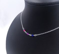 "Handmade sterling silver necklace. Different colored crystal beads making up the bisexual pride flag. Delicate silver chain. Order at least 2.5 cm (1\") longer than the intended wearers neck for a tight fit. Longer for a looser fit. Matching bracelet: https://www.etsy.com/listing/1024658633 Necklace and bracelet set (lower price): https://www.etsy.com/listing/1010685590 This is is a made to order listing and you'll get a necklace like the one in the pictures, not the exact copy in the pictures. Sterling Silver Crystal Necklace With Silver Beads For Gift, Gift Sterling Silver Crystal Necklace With Silver Beads, Sterling Silver Beaded Necklace With Adjustable Chain For Gifts, Sterling Silver Beaded Necklace With Adjustable Chain, Gift Crystal Necklace With Beaded Sterling Silver Chain, Gift Crystal Necklace With Beaded Chain In Sterling Silver, Sterling Silver Crystal Necklace With Beaded Chain For Gift, Bisexual Pride Flag, Beads Making