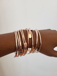 Handmade and high quality stackable ROSE GOLD bangles.  CLEARANCE, CLEARANCE Available as a set of THREE, FIVE or TEN SAME DAY SHIPPING 🌙Moon Goddess items are created with raw brass materials. Brass jewelry is known to have metaphysical energy and to enhance the flow of energy within the body, facilitating spiritual practices such as meditation or energy healing.  🌖Because of it's flowing energy, brass will over time develop patina. 🌕Maintain your pieces by storing in away from storing in a Adjustable Stackable Rose Gold Bangle, Bohemian Gold Bangle For Rituals, Luxury Brass Bangle Bracelets, Bronze Bohemian Bangle, Spiritual Brass Cuff Bracelet Bangle, Spiritual Bronze Brass Bangle, Rose Gold Bangles, Bracelets Boho, Rose Gold Bangle