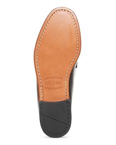 These classic penny loafers are perfect for any casual Instagram outfit. Featuring a round moc-stitch toe and penny strap accents, they have a vintage-inspired aesthetic that looks great in any snap. Made from premium leather that will age beautifully over time, they are comfortable enough for all-day wear yet polished enough for any social media shot. True to size for easy ordering, slip these loafers on and instantly elevate your look. Slip-on Leather Moc Toe Oxfords With Leather Footbed, Slip-on Moc Toe Oxfords With Leather Footbed, Masculine Wingtip Moccasins With Leather Sole, Slip-on Dress Shoes With Stitched Sole In Bridle Leather, Leather Snip Toe Loafers With Rubber Sole, Bridle Leather Loafers With Rubber Sole, Slip-on Moc Toe Dress Shoes With Leather Sole, Business Moc Toe Slip-ons, Bridle Leather Moccasins With Round Toe And Leather Sole