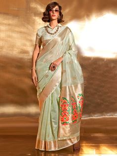 Many popular designers have chosen the pista green color tissue silk saree with zari weaving work to bring elegance and glamour to the forefront of fashion.
This gorgeous pista green zari weaving silk event wear saree with blouse is a stunning addition to any wardrobe, perfect for weddings, festivals, and other special occasions.
Measuring 5.50 meters, the saree provides ample fabric for graceful draping, complemented by unstitched blouse material for personalized customization.
The gorgeous pis Pastel Saree, Tissue Fabric, Pista Green, Dress Saree, Sea Green Color, Party Sarees, Tissue Saree, Saree Fashion, Indian Wedding Wear