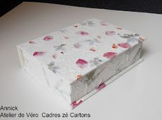 a white box with pink and red flowers on it