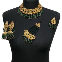 Green bridal jewellery set. Set includes-   Earrings  Tikka Necklace  Jhumar Elegant Sets With Latkans For Gifts, Elegant Gift Sets With Latkans, Elegant Lehenga For Festive Gift, Elegant Festive Lehenga As A Gift, Elegant Lehenga For Festive Occasions As A Gift, Elegant Green Lehenga With Stone Work, Elegant Lehenga For Festive Occasions, Elegant Green Kundan Necklace With Latkans, Wedding Jewelry For Eid With Tilla Detail