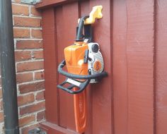 a chainsaw attached to the side of a building