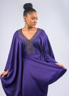 This super gorgeous kaftan has an added beaded embellished appliqué on the neckline. This dress is the perfect definition of a luxury kaftan. Has a belt inside that can be tight around the waist to give a nice snatch. Fun and easy to wear. Elegant V-neck Kaftan With Embroidered Neckline, Elegant Tunic Dress With Embroidered Neckline, Elegant Long Sleeve Kaftan With Embroidered Neckline, Party Embellished Long Sleeve Thobe, Elegant Tunic Kaftan With Embroidered Neckline, Elegant Kaftan With Embroidered Neckline, Elegant Party Kaftan With Embroidered Neckline, Embellished Evening Thobe For Eid, Bohemian Style Embellished Evening Kaftan