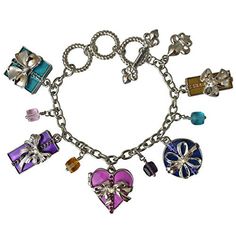 Charm Bracelets "Life's a Gift" - Bracelets For Women This very merry silvertone fashion accessory features a collection of festive presents that are tricked-out with beautiful bows, rhinestones, and colorful enamel. Additional strands of faceted beads are added into the mix, too, for a glamorous look. Adjust this bold toggle charm bracelet with the toggle clasp to a size that best suits you. Show your love for all things Christmas by wearing a little holiday cheer! Did someone say Christmas? Th Elegant Multicolor Jewelry For Birthday Gift, Adjustable Multicolor Jewelry For Holiday, Personalized Multicolor Charm Bracelet For Gift, Metal Bracelet Jewelry Gift, Metal Bracelet Jewelry For Gifts, Silver Bracelets For Holiday, Silver Holiday Bracelet, Silver Bracelet For Holiday, Metal Chain Bracelet With Charms For Gift