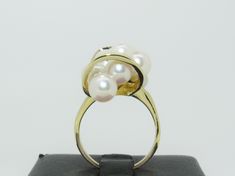 This unique piece features 10 luscious (approx. 4.92 mm to 6.75 mm) Pearls. Set in 14K yellow gold. This ring is in excellent pre-owned vintage condition. The size is a 7.5. Total weight is approx. 9.9 grams. (T6 * MJP032592) Please review all photos before purchasing and feel free to ask questions about the item :) For more information you can call us at 360-657-5276. We are sorry but we do NOT offer INTERNATIONAL SHIPPING! Payment due upon checkout to avoid shipping delays and loss of purchase Classic Yellow Gold Rings With High Luster, Formal 14k Gold Pearl Ring With High Luster, Formal Yellow Gold Pearl Ring With High Luster, Formal High Luster Yellow Gold Pearl Ring, 14k Yellow Gold High Luster Pearl Ring, Yellow Gold Fine Jewelry Rings With High Luster, Timeless Gold Rings With High Luster, High Luster Yellow Gold 14k Ring, Timeless High Luster Rings For Formal Occasions