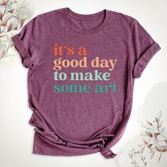 It's A Good Day To Make Some Art Shirt, Art Teacher Shirt, Artist T-Shirt, Art Lover Tee, Art Shirt, Gift For Teacher, Teacher Art Tshirt. Hello, Welcome to Blue Unique Boutique, your destination for unique and handcrafted shirts! I'm Eve! I have been thinking about creating my business for a long time and now I have taken the first step towards it and it gives me excitement. As a small business, I take pride in creating unique designs from the comfort of our homes. Each shirt is carefully craft Artistic Graphic Print Tops As Gift, Artistic Graphic Print Top As Gift, Artistic Graphic Print Top As A Gift, Artistic Short Sleeve Top With Text Print, Artsy Cotton Tops With Letter Print, Artsy Short Sleeve Top With Funny Print, Artistic Cotton T-shirt For Gift, Graphic Tee With Graphic Design For Gift, Graphic Tee Tops As Gift