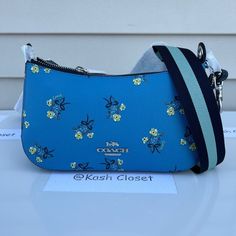 100 % Authentic Coach!! ** Firm On Price ** Details: Printed Coated Canvas And Smooth Leather Inside Multifunction Pocket Zip-Top Closure, Fabric Lining Detachable Strap With 22 1/2" Drop For Shoulder Or Crossbody Wear Dimensions : 9 1/2" (L) X 5" (H) X 2 1/2" (W) Approx Color : Blue Size : Os Msrp : (Not Specified) **Comes From Smoke & Pet Free Environment ** #Mk #Michael Kors #Wallet #Wristlet #Designerbag #Leather #Newcollection #Gift #Kashcloset #Collection #Giftset #Shoes #Boots #Designersh Spring Coach Shoulder Bag With Adjustable Strap, Coach Shoulder Bag With Removable Pouch For Spring, Spring Coach Shoulder Bag With Removable Pouch, Blue Coach Bag With Zipper Closure, Blue Coach Bags With Zipper Closure, Messanger Bag, Satchel Backpack, Bow Print, Cute Handbags