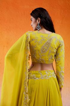 Featuring a daisy yellow lehenga set in georgette base with threadwork, cutdana and moti hand embroidery. It is paired with a matching embroidered georgette blouse and an organza dupatta. Yellow Resham Embroidery Palazzo Set In Georgette, Yellow Georgette Palazzo Set With Traditional Drape, Yellow Resham Embroidery Georgette Palazzo Set, Yellow Resham Embroidered Georgette Palazzo Set, Yellow Georgette Palazzo Set With Resham Embroidery, Semi-stitched Yellow Georgette Palazzo Set, Yellow Cutdana Sets For Reception, Designer Yellow Georgette Palazzo Set, Designer Yellow Cutdana Sets