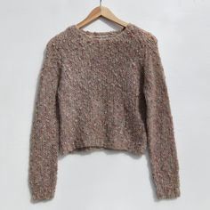 "Vintage 1980's wool blend sweater featuring a marled fluffy boucle texture. Handknitted in Hong Kong. Size label states this is a medium, but it could also be a looser 'small'. Colours: Beige with flecks of pink and lilac.  Material:  48% acrylic 22% mohair 22% wool 6% polyester Size: Sml/Medium. Measurements taken with garment laid flat: Shoulder to shoulder\" 15\" Pit to pit: 16\" Length: 19\" In great vintage condition with no stains, holes, pulls, musty smells." Cozy Melange Sweater For Fall, Arrow Jewelry, Elizabeth Street, Boucle Sweater, Beige Pullover, Cozy Pullover, Pullover Sweater Women, Beige Sweater, Wool Blend Sweater