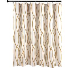 a shower curtain with gold wavy lines on the bottom and bottom, in front of a white background