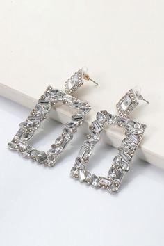 Modern Silver Alloy Earrings, Pierced Alloy Jewelry For Party, Trendy Silver Rectangular Earrings, Trendy Silver Metal Crystal Earrings, Silver Alloy Crystal Earrings, Silver Diamond Crystal Earrings With Plating, Elegant Silver Earrings With Stones, Silver Rectangular Cubic Zirconia Earrings, Dazzling Silver Crystal Earrings