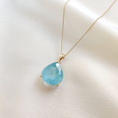 This stunning pendant is set in 14K Solid Yellow Gold with Natural Aquamarine with utmost precision. It is an unique gemstone pendant for nearly every occasion and is completely hassle-free jewelry. ITEM DETAILS * Gem: Aquamarine * Gem Size: 14X15mm * Gem Shape: Pear * Gem Weight: 10.87 carats * Gold Purity: 14KT  * Gold Weight: 1.16 gram * Total Weight of the Pendant: 3.33 gram The Gold purity is guaranteed and it comes with authentic 14KT gold hallmark. Since my items are handmade, they are absolutely nickel and lead free. CUSTOMIZATION * Gemstone customization is available and it can be substituted with a gem of your choice. Kindly message me for the same. PACKAGING * The Pendant comes with layers of safe and secure wrapping along with Free handmade jewelry box with every purchase. ➡️He Sapphire Pear-shaped Gemstone Necklace, Pear Shaped Sapphire Necklace For Gift, Pear Shaped Sapphire Necklace As Gift, Pear-shaped Sapphire Necklace Gift, Pear-shaped Yellow Gold Gemstones For Gifts, Blue Pear-shaped Jewelry As Gift, 14k Gold Pear-shaped Gemstone Necklace, Blue Pear-shaped Jewelry For Gifts, Blue Pear-shaped Jewelry Gift