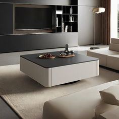 a modern living room with black and white furniture