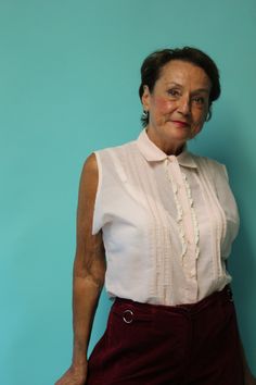 "Sweet as can be, this pastel pink mid century blouse has fine detailing, sweet buttons in front and an added bit of vintage lace to top it off! Adorable! This summer blouse is sleeveless, and the inside tag has been removed, so I don't have a maker, size, or washing instructions to include. All buttons are present, and condition seems to be very good, with one glaring exception -- It appears someone has made the blouse larger than the original by letting out side seams under the arms. It's a gr Pink Tops With Lace Collar For Daywear, Chic Pink Top With Lace Collar, Retro Pink Button-up Blouse, Chic Pink Blouse With Lace Collar, Pink Blouse With Lace Collar For Daywear, Vintage Sleeveless Daywear Blouse, Vintage Pink Tops With Button Closure, Vintage Pink Tops With Buttons, Vintage Sleeveless Blouse For Daywear