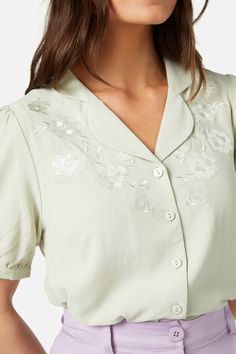 Floral embroidered short sleeve blouse. The perfect office or casual style - open styled collar - short puff sleeve with cuff - button through front - made of a viscose tencle blend - available in lilac & mint Product Code: PGFY126 Short Sleeve Embroidered Shirt For Work, Elegant Collared Rayon Blouse, Summer Embroidered Shirt With Collared Neckline, Feminine Short Sleeve Shirt With Buttons, Spring Short Sleeve Blouse With Buttons, Short Sleeve Spring Blouse With Buttons, Collared Rayon Blouse For Daywear, Fitted Embroidered Top With Collared Neckline, Fitted Short Sleeve Shirt With Cuffed Sleeves