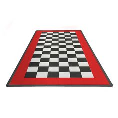 a black and white checkerboard rug with red border on the bottom, in front of a white background