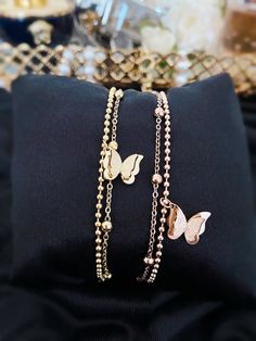 Our Beautiful Butterfly Beaded Two Double Chain Bracelet in Gold & Rose Gold Colour is the perfect blend of style and sophistication.  Made with high-quality materials, this chain exudes luxury and is sure to make a statement. - Stainless Steel - Non-Tarnish  - Nickel Free  - Water Resistant  The classic design is timeless and will never go out of style. It's the perfect accessory for any occasion, whether you're dressing up for a night out or just want to add a touch of glam to your everyday lo Party Rose Gold Bracelets With Delicate Chain, Rose Gold Delicate Chain Bracelet For Party, Elegant Party Bracelets With Beaded Chain, Trendy Rose Gold Charm Bracelet For Party, Trendy Rose Gold Beaded Bracelets For Party, Elegant Beaded Chain Bracelets For Party, Elegant Beaded Bracelets For Party, Elegant Ball Chain Bracelet As Gift, Elegant Ball Chain Bracelet Gift