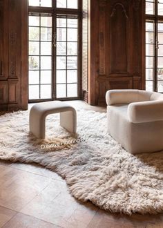 a white chair sitting on top of a shaggy rug