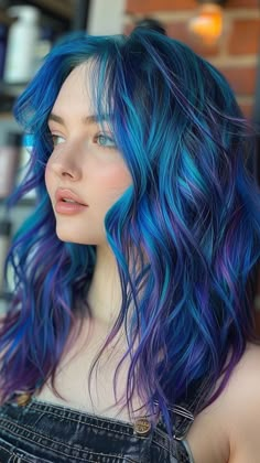 26 Blue Hair Color Ideas That Will Elevate Your 2024 Glamour Galaxy Hair Underneath, Blue Galaxy Hair, Purple Hair Blue Highlights, Pastel Galaxy Hair, Mermaid Hair Color Short, Vivid Blue Hair, Blue And Purple Hair Highlights, Blue Hair With Highlights, Purple And Blue Hair Color Ideas