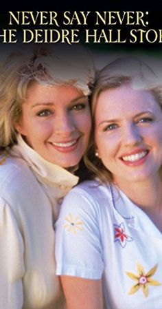 two women are posing for the camera with their arms around each other, both smiling