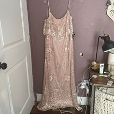 a dress hanging on a wall next to a door