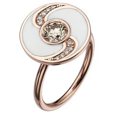 SKU# 4006106 A round shaped white enamel ring that exudes elegance and sophistication. The ring features a center Fancy Orangy Brown round SI1 diamond that weighs 0.73ct and is complemented by 10 additional diamonds that have a total weight of 0.10ct D-F VS. Crafted from high-quality materials, this ring is made of 18k rose gold and has a total weight of 7.06gr, ensuring a sturdy and durable design. The size of the ring is 7.5 The round shaped white enamel adds an exquisite touch to the ring, en White Luxury Enamel Ring For Formal Events, Formal Round Enamel Diamond Ring, White Enamel Fine Jewelry Ring, Elegant Enamel Rings With Polished Finish, Elegant White Enamel Ring For Anniversary, Rose Gold Enamel Ring, Formal White Enamel Rings, Elegant Enamel Diamond Ring, White Enamel Rings With Polished Finish