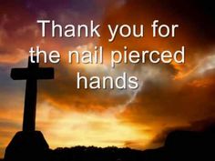 a cross with the words thank you for the nail pierced hands on it in front of a sunset