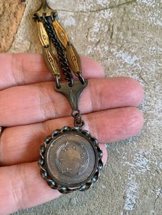 "Unique, rare vintage European gold-plated, copper & black metal watch fob pendant necklace with horse jockey charm. This fob is old stock and was never used. It has lots of beautiful detail, which includes gold-plated decorative links, black links & chain. The beautiful copper charm features a black twist metal frame with an image of a jockey jumping his horse over a fence. The fob is reversible and has a wreath design on the reverse side. I added a vintage, etched brass link chain whic Vintage Coin Shaped Medallion Necklace, Vintage Bronze Necklaces With Coin Pendant, Vintage Coin Medallion Necklace, Vintage Bronze Necklace With Coin Pendant, Collectible Historical Jewelry With Antique Finish, Collectible Antique Finish Historical Jewelry, Vintage Coin Necklace For Collectors, Vintage Coin Necklaces For Formal Occasions, Collectible Medallion Necklace With Vintage Charm