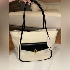 Cream And Black Worthington Claudet Tote Bag With Black Strap. One Small Zipper Pocket And Two None-Zip Pockets. Large Front Pocket With A Gold Opening Clasp. Unused And Tags Still On! Front Pocket, Zipper Pocket, Zip Pockets, Bag Lady, Shoulder Bag, Tote Bag, Zipper, Cream, Handbags