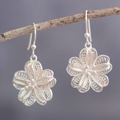 Cool silver shines in these feminine flower earrings from Peru's Alfredo Inga. The artisan crafts the dangle earrings from sterling silver in the time-honored technique of filigree. Sterling Silver Filigree, Silver Filigree, Artisan Craft, Hook Earrings, Alfredo, Flower Earrings, Crochet Earrings, Dangle Earrings, Jewelry Earrings