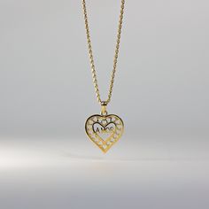 Own a tangible representation of love in the most elegant way. This 14K solid gold heart-shaped pendant is the most sophisticated way of showing love to your special someone. Whether that be yourself or a significant other. This gold heart pendant will captivate not only the eyes but also the heart of the person who will receive it. Made from the finest 14K solid gold material, this heart-shaped pendant is a real symbolism of luxury and of love. Make it yours and add it to your collection. This Heart Pendant Gold, Gold Moon, Gold Initial, Significant Other, Gold Letters, Initial Letters, Moon Pendant, Heart Of Gold, Real Gold