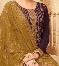 COLOR : Wine & Marigold Brown FABRIC : Top - Pure Georgette, Bottom & Inner - Dull Santoon, Dupatta - Pure Georgette WORK : Heavy Resham Embroidery, Zari Work, Sequins, Stones, Motifs, Lace Border OCCASION : Wedding, Reception, Engagement, Party Wear, Festival READY-TO-WEAR : NoSTITCHING : Available as semi-stitched fabric, can be stitched using standard size option (+$20). Note: There might be a slight color variation due to lighting and flash used during photoshoot. The bright shade seen is th Resham Embroidery, Holiday Promotions, Embroidered Pants, Money Transfer, Zari Work, Pant Suit, Suit Fabric, Brown Fabric, Lace Border