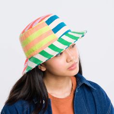 Knit bucket hat with colorblock stripe patchwork. Made from colorful, soft hypoallergic yarn. From sunny summer beach days to cold winter walks, this bucket hat is destined for year-round wear. Each hat is one of a kind – patchwork pattern placement may vary, but that's the fun of it! Fully lined. Details Body: 100% Acrylic Lining: 100% Deadstock poly-cotton fabric Machine wash gentle, lay flat to reshape and dry8.5"w, 3.5"h, 2.25" brim, 22" interior circumference Stripe Patchwork, Knit Bucket Hat, Winter Walk, Patchwork Patterns, Ux Web Design, Web Development Design, Beach Days, Striped Knit, Design Development