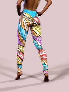 a woman is wearing colorful leggings with her back to the camera