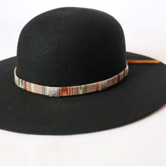 Woven cotton hat band with variations of red and blue. This band comes with detailed metal conchos. Adjustable with brown leather tie. Handmade in Guatemala Adjustable hatband *This product is for 1 single hat band. Hat not included. Sunset Skies, Hat Bands, Colorful Hat, Leather Tie, Cotton Hat, Western Hats, Sunset Sky, Hat Band, Aztec Print