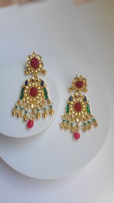 Pure Ahmedabadi pach kundan earrings crafted to perfection! A refined jewelry engraved with precious pachi kundan stones! Each piece has an intricate bead work to enrich its elegance. Size: 2.5 inches Occasion: festival or wedding or casual Metal : copper Stones: pachi kundan Handmade Made in india Care: wipe ur jewelry with soft cloth after each use and store in a airtight plastic bag! Don't soak in water Festive Kundan Cutdana Earrings, Diwali Kundan Drop Earrings, Diwali Festive Kundan Chandelier Earrings, Festival Kundan Pendant Earrings, Festive Kundan Gemstone Earrings, Kundan Earrings, Earring Crafts, Plastic Bag, Bead Work