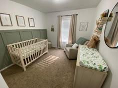 a baby's room with a crib, chair and bed in it is shown