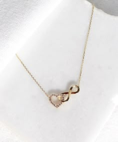 14K Gold Heart and Infinity Symbol Necklace A symbol of infinite love, this elegant necklace showcases the symbols of love and eternity entwined with each other. The heart motif perfectly complements the infinity symbol for a truly romantic look. This unique necklace is perfect for everyday wear as it is made of solid gold and won't tarnish. It is a wonderful gift for a special person. Features: * This necklace is made of patented 14K solid gold. * Length: 42 cm Packaging: You will get your jewe Valentine's Day Infinity Chain Jewelry, Jewelry Photography Tutorial, Heart And Infinity, Infinity Symbol Necklace, Stylish Jewelry Accessories, Eternity Necklace, Gold Heart Locket, Symbols Of Love, Neck Pieces Jewelry