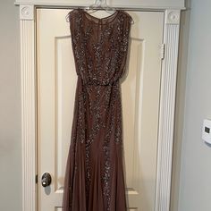 Women Party Dress New Brand:Aidan Mattox Size 8 Color : Sepia / Sequins New With Tag Brown Floor-length Maxi Dress For Evening, Sleeveless Evening Gown For Festive Occasions, Champagne Sleeveless Mother Of The Bride Dress For Evening, Sleeveless Champagne Mother Of The Bride Dress For Party, Brown Floor-length Wedding Dress, Sleeveless Festive Maxi Dress For Prom, Festive Sleeveless Maxi Dress For Prom, Sleeveless Brown Maxi Dress For Formal Occasions, Brown Sleeveless Maxi Dress For Formal Occasions